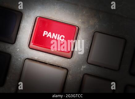 Red button on a dirty old panel Stock Photo