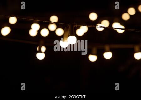 The chain of light bulbs at event. Stock Photo