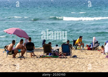 Group of young people on the beach, summer vacation. Stock Photo