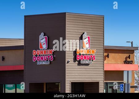 Victorville, CA, USA – March 17, 2021: Dunkin Donuts signage on a building in Victorville, California. Stock Photo