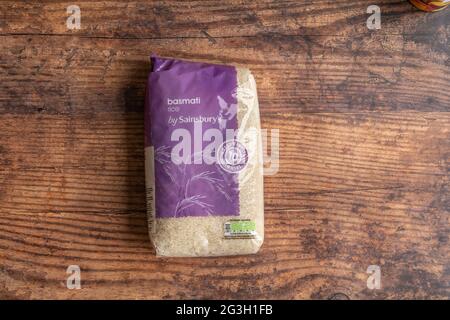 Irvine, Scotland, UK - June  15, 2021:  Sainsbury’s Branded Basmati rice displaying symbols with Kcal values and other relevant information. Product c Stock Photo