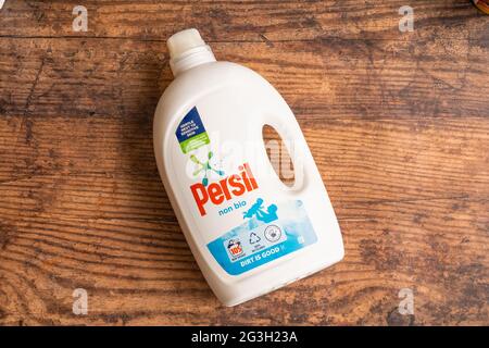 Irvine, Scotland, UK - June  15, 2021: Persil Branded Non Bio liquid detergent in white plastic bottle and cap that is recyclable and displaying 100% Stock Photo