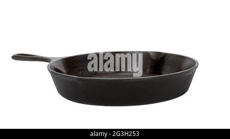 Black seasoned cast iron skillet with a white background Stock Photo