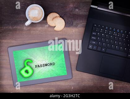 Tablet on a desk, concept of data protection Stock Photo