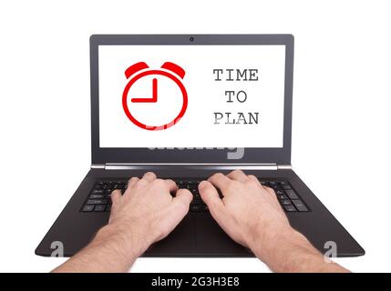 Man working on laptop, time to plan Stock Photo