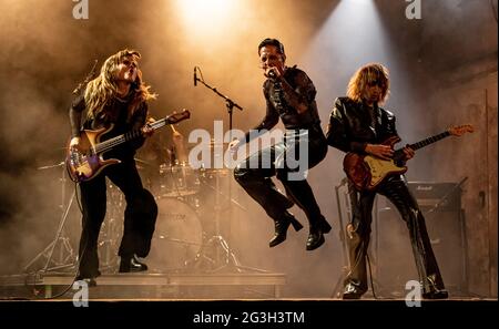 Berlin, Germany. 16th June, 2021. Victoria De Angelis (l-r), Damiano David and Thomas Raggi of the band Maneskin perform a live concert for the video portal TikTok at SchwuZ Queer Club. Credit: Fabian Sommer/dpa/Alamy Live News Stock Photo