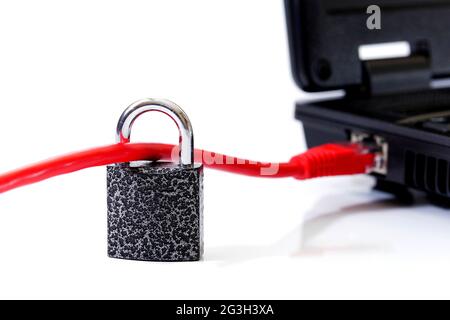 padlock locked on red network cable connected to laptop on white background, cyber security concept Stock Photo