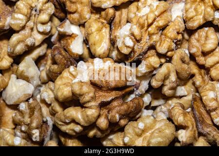 Close up background with peeled walnuts, macro photo. Stock Photo