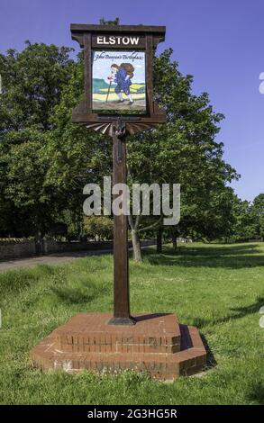 BEDFORD, UNITED KINGDOM - Jun 14, 2021: Elstow village sign, the birthplace of John Bunyan. The sign has a different image on each side and stands by Stock Photo