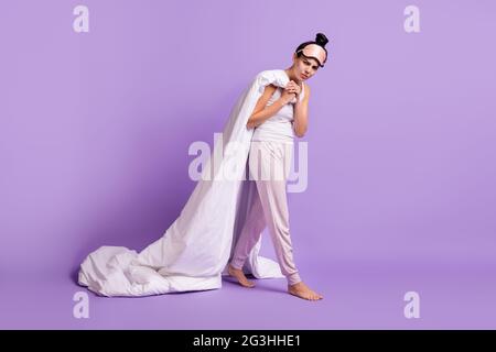 Full length body size photo of girl keeping blanket dont want to get up moody grumpy isolated pastel purple color background Stock Photo