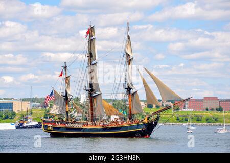 Seen during the Tall Ships parade at Halifax Harbour three years before she was lost at sea, replica ship HMS Bounty at full sail. Stock Photo