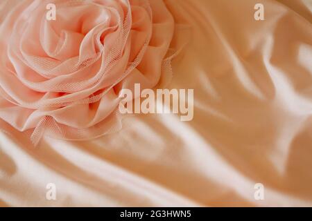 Beautiful rose from fabric, bright festive wedding background. Copy space Stock Photo