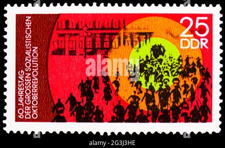 MOSCOW, RUSSIA - APRIL 15, 2021: Postage stamp printed in Germany shows Storming the Winter Palace, 60th Anniversary of the Socialist October Revoluti Stock Photo