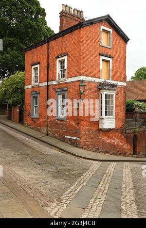 House at the top of Steep Hill, Lincoln, UK: 4th steepest hill in England at 16% or approximately I in 6 gradient. Stock Photo