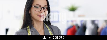 Smiling portrait of woman designer in tailor shop Stock Photo