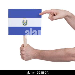 Hand holding small card - Flag of El Salvador Stock Photo