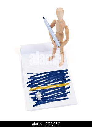 Wooden mannequin made a drawing - Nauru Stock Photo