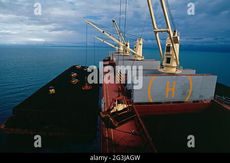 the cargo ship, bulk carrier vessel unloading steaming cargo at the ...