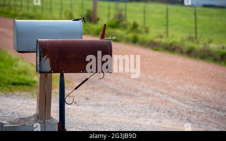 Two mailboxes in a country setting portray a feeling of expectancy and anticipation as to what correspondence will be received and communicated. Bokeh Stock Photo
