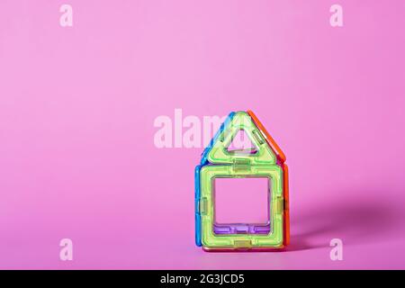 children's magnetic designer for development of motor skills, thinking and imagination. construction assembled from multi-colored parts of children's Stock Photo