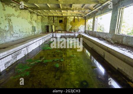 Abandoned school swimming pool in ghost town Pripyat Chornobyl Zone, radiation, nuclear catastrofe Stock Photo