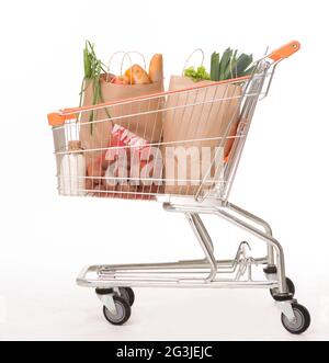 Shopping cart with shopping bags Shopping cart with shopping bags Stock Photo