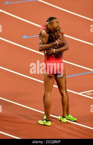 LONDON, ENGLAND - AUGUST 5, DeeDee Trotter and Sanya Richards-Ross of the United States hug each other after women’s 400m final during the evening session of athletics at the Olympic Stadium  on August 5, 2012 in London, England Photo by Roger Sedres / Gallo Images Stock Photo