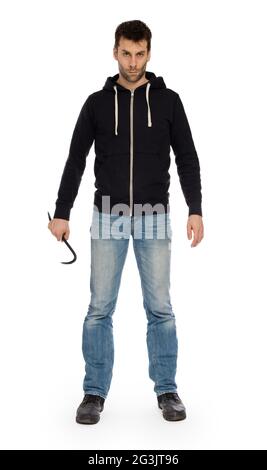 Crime concept. Criminal in hood with crowbar in hand Stock Photo