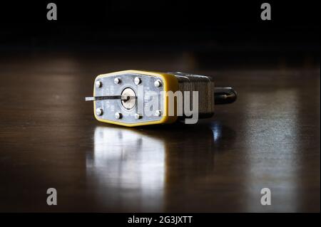 Padlock with Key Sitting on a Wood Table Stock Photo