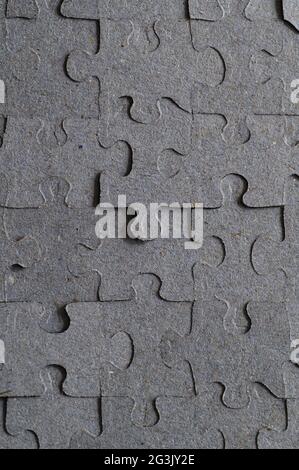 Grey Paper Puzzle with Uneven Pieces Stock Photo