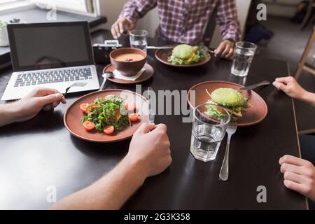 Business people in vegan restaurant Stock Photo