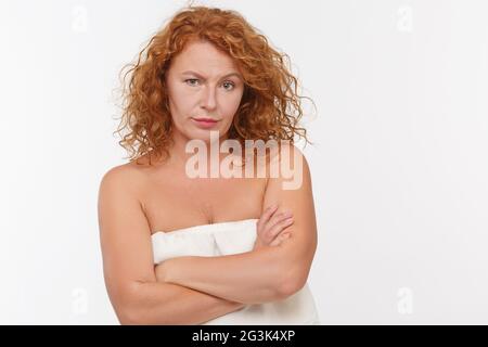 Distrustful mature woman Stock Photo