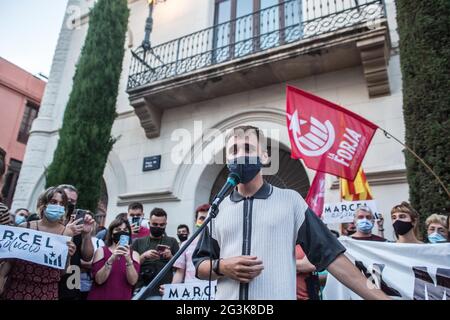 Marcel Vivet wearing a mask speaks to protesters during the demonstration.Hundreds of people have demonstrated in Badalona, a city next to Barcelona in solidarity with Marcel Vivet, who has been sentenced to five years in prison for the incidents that occurred in a Catalan independence demonstration in September 2018 in Barcelona against an act of the police union, Jusapol (Police Salary Justice). Vivet has been tried for a crime of public disorder and attack against an agent of the authority. The demonstration was attended by Dolors Sabater, Deputy of the Parliament of Catalonia and Elisenda Stock Photo