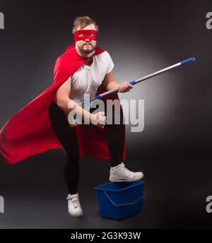 Super hero with cleaning equipment Stock Photo