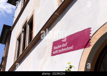 Staufen Im Breisgau, Germany. 01st June, 2021. A sticker reading 'Staufen must not break!' is stuck on the town hall of the city. The town in Breisgau has been struggling with cracks in the historic town centre caused by heaving in the ground since a momentous geothermal borehole in 2007. In the vicinity of the Upper Rhine Graben, it can be seen in a small area what geothermal energy can do - and where it causes problems. Credit: Philipp von Ditfurth/dpa/Alamy Live News Stock Photo