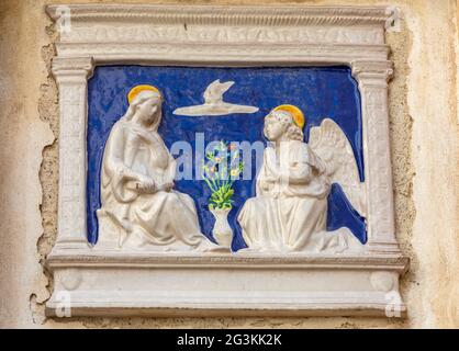 Marble bas-relief depicting the Annunciation on the wall of a house in Polignano a Mare. Italy Stock Photo