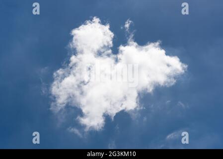 Beautiful cloudscape of nature single white cloud on blue sky background Stock Photo