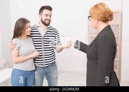 Receiving keys after purchasing a new home. Stock Photo