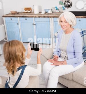 Grandmother posing for camera Stock Photo