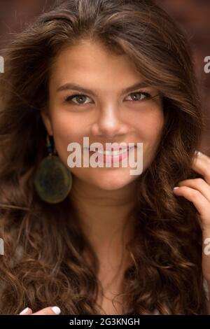 Close up portrait of young curly woman. Stock Photo
