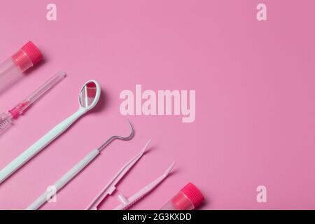 Medical instruments, devices and items on the colored table in the hospital. Syringe, test tube, tweezers. Healthcare, medicine, treatment and doctors concept. High quality photo Stock Photo