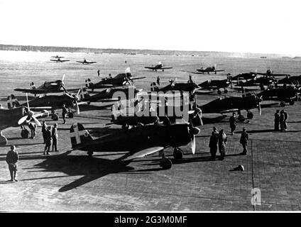 Second World War / WWII, aerial warfare, fighters Macchi C.200 Saetta of the Italian Air Force on an airbase, EDITORIAL-USE-ONLY Stock Photo