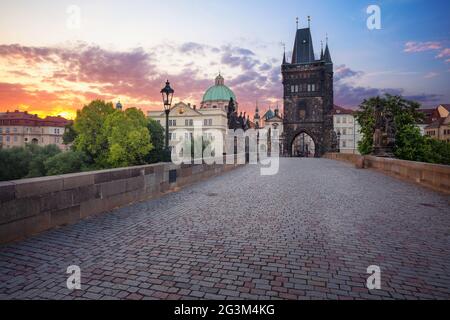 Prague, Charles Bridge. Cityscape image of iconic Charles Bridge with Old Town Bridge Tower in Prague, Czech Republic at sunrise. Stock Photo