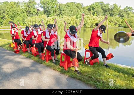 Middle age Chinese American dancer performing artists rehearse a rowing routine at a park in Flushing, Queens, New York City Stock Photo