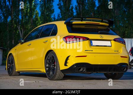 Mercedes-AMG A 35 in city parking at night Stock Photo