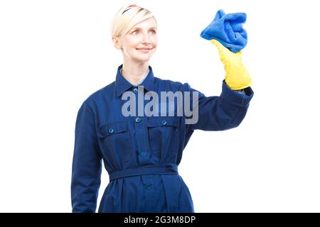 Horizontal medium portrait of successful beautiful Caucasian woman working in cleaning service wearing uniform holding cleaning products Stock Photo