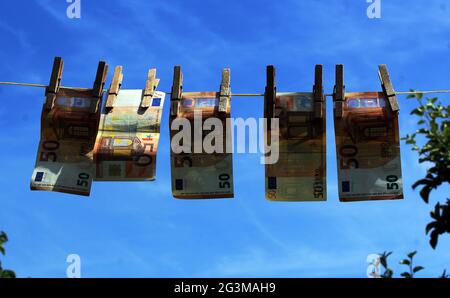 Illustration photo, How criminals clean their dirty money, launder money, laundering. Euro Bank notes hanging on a clothesline. (CTK Photo/Milos Ruml) Stock Photo