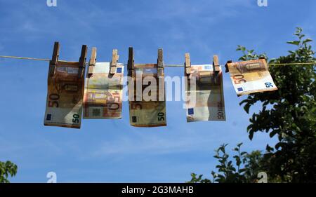 Illustration photo, How criminals clean their dirty money, launder money, laundering. Euro Bank notes hanging on a clothesline. (CTK Photo/Milos Ruml) Stock Photo