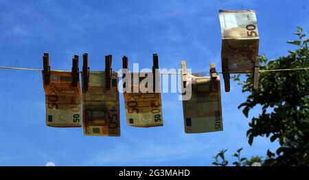 Illustration photo, How criminals clean their dirty money, launder money, laundering. Euro Bank notes hanging on a clothesline. (CTK Photo/Milos Ruml) Stock Photo