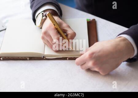 Businessman making notes on the paper Stock Photo